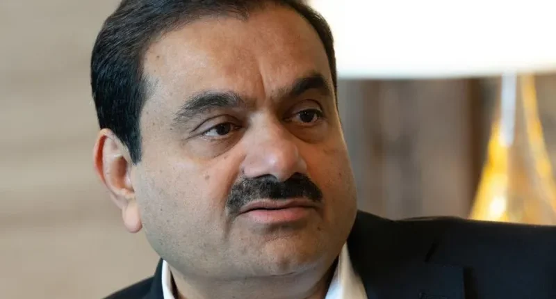 Mr Adani's sprawling $169bn empire spans ports and renewable energy
