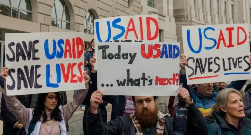 Demonstrators outside the US Agency for International Development (USAID) headquarters in Washington, DC on Monday