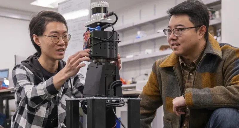 Prof Mingmin Zhao (right) has been working on a radio vision system for robots